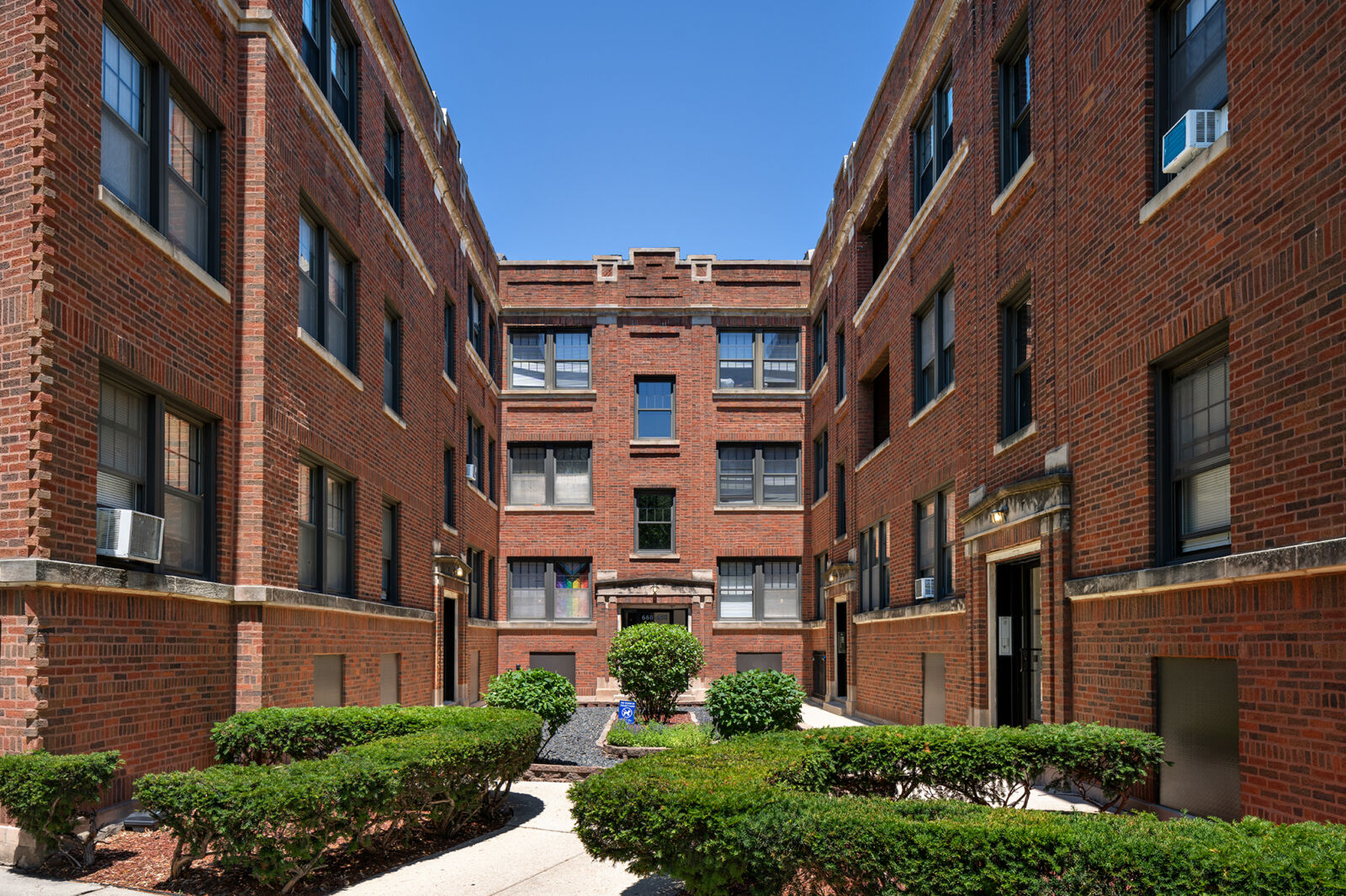 A three-story red brick apartment building at 654–664 West Cornelia Avenue in Chicago’s Lakeview ...