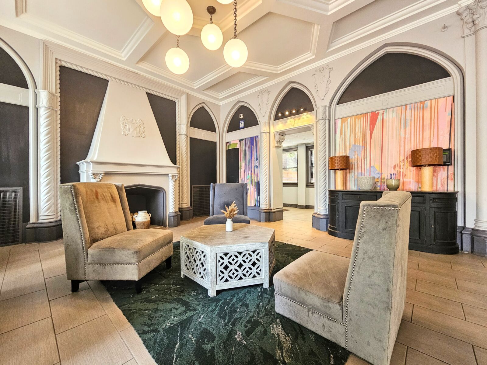 The lobby at 505 West Belmont Avenue featuring high coffered ceilings, arched wall panels, and a ...