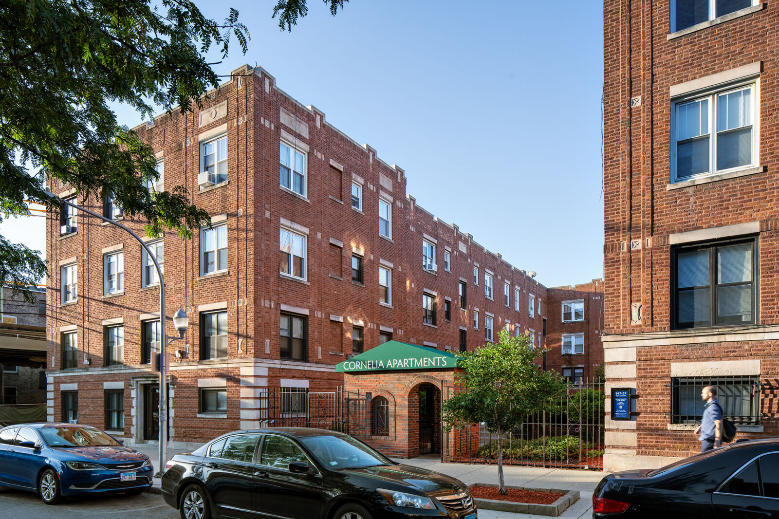 A three-story red brick apartment building at 947–957 West Cornelia Avenue in Chicago’s Lakeview ...
