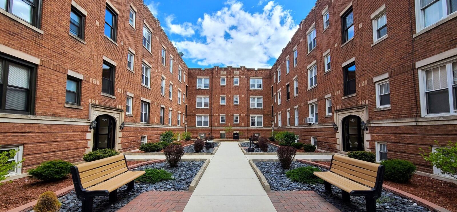 A three-story red brick apartment building at 947–957 West Cornelia Avenue in Chicago’s Lakeview ...