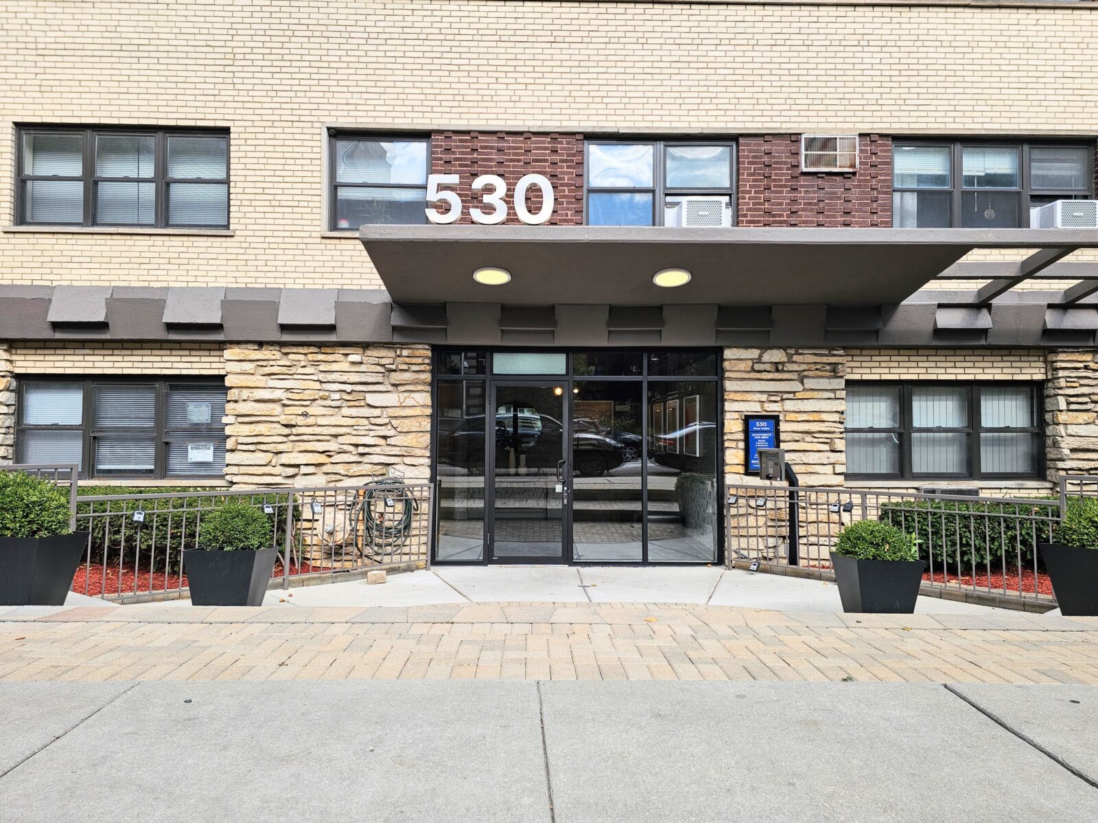 The main entrance of 530 West Aldine  in Chicago’s Lakeview neighborhood, showing the building nu...