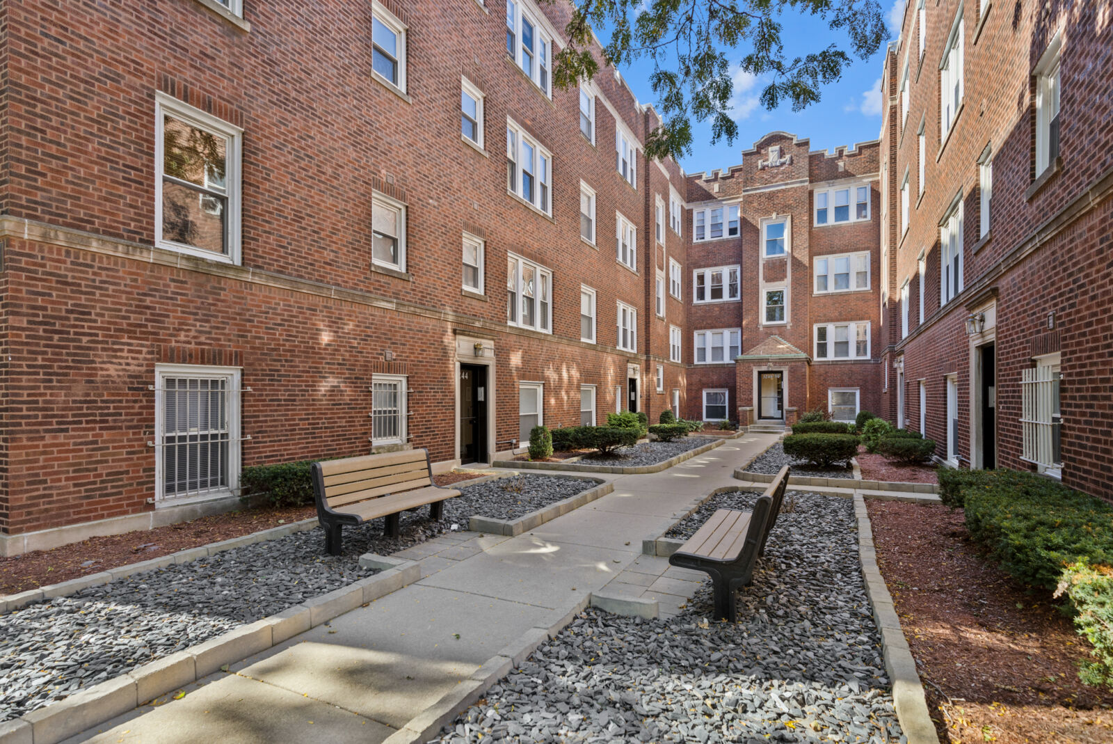 Courtyard view at 3244–3254 North Clifton Avenue in Chicago’s Lakeview neighborhood, showing red ...