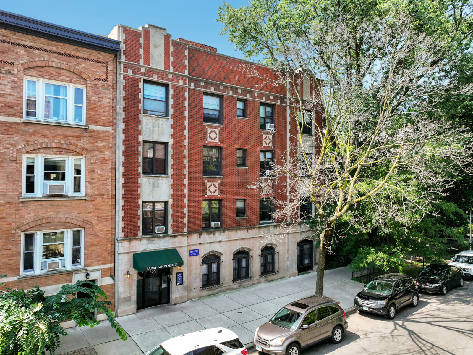 A four-story red brick apartment building at 635 West Barry Avenue in Chicago’s Lakeview neighbor...