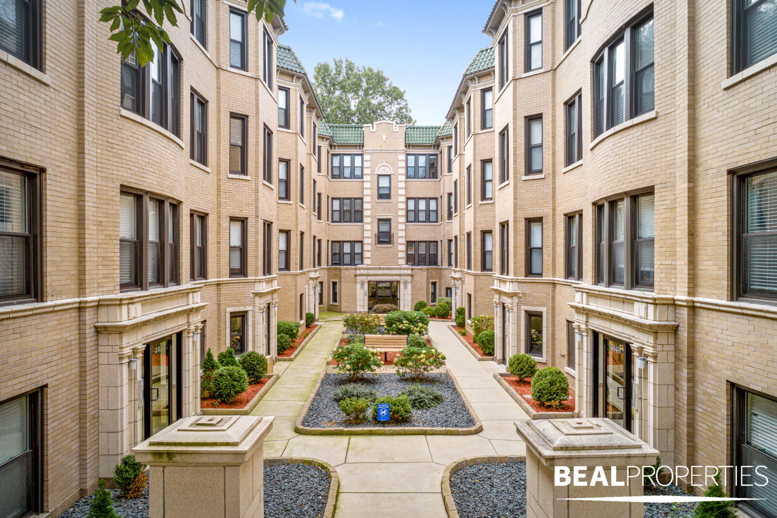 The landscaped courtyard at 4034 North Ashland Avenue in Chicago’s Lakeview neighborhood, framed ...