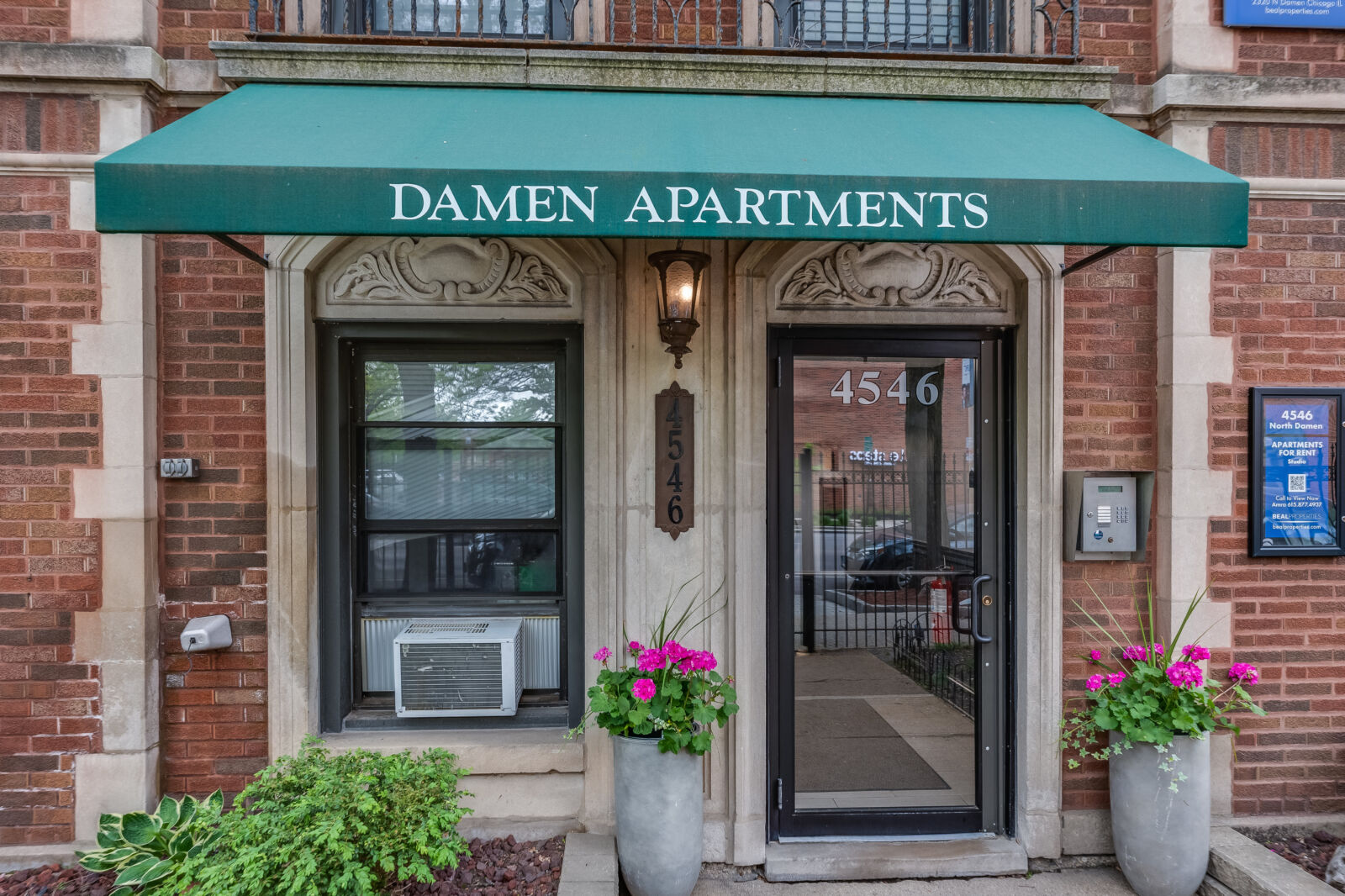 Detail of the front entrance at 4546 North Damen Avenue in Chicago, highlighting the building’s a...